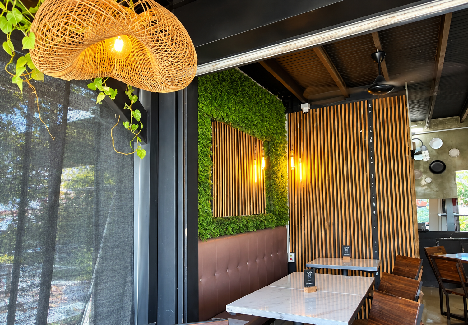 Tables and seating at Zona K Atelier, restaurant in Jaco, Costa Rica